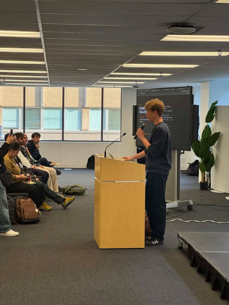 Founder Andrei Gladkikh speaking at a tech event